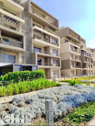 Apartment with garden Wide lagoon view Fully finished in Palm Hills New Cairo